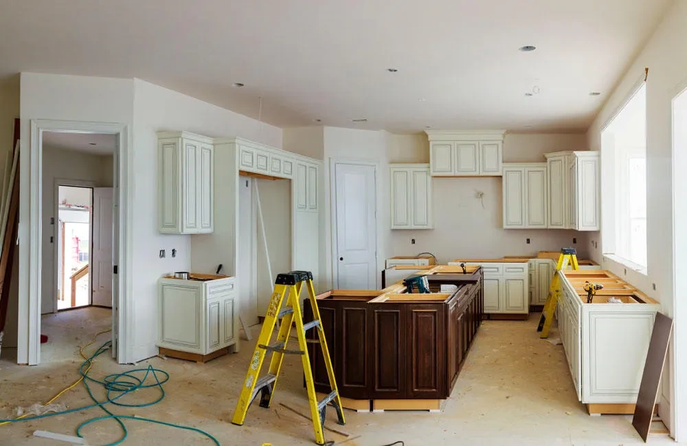 Kitchen renovation in progress with cabinets being installed, kitchen fit-out and renovation services in Dubai by Limech